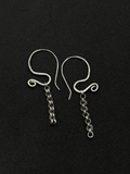 Handcrafted sterling silver Sculptural Motion Earrings with curved hooks and dangling chain links