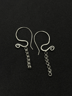 Handcrafted sterling silver Sculptural Motion Earrings with curved hooks and dangling chain links