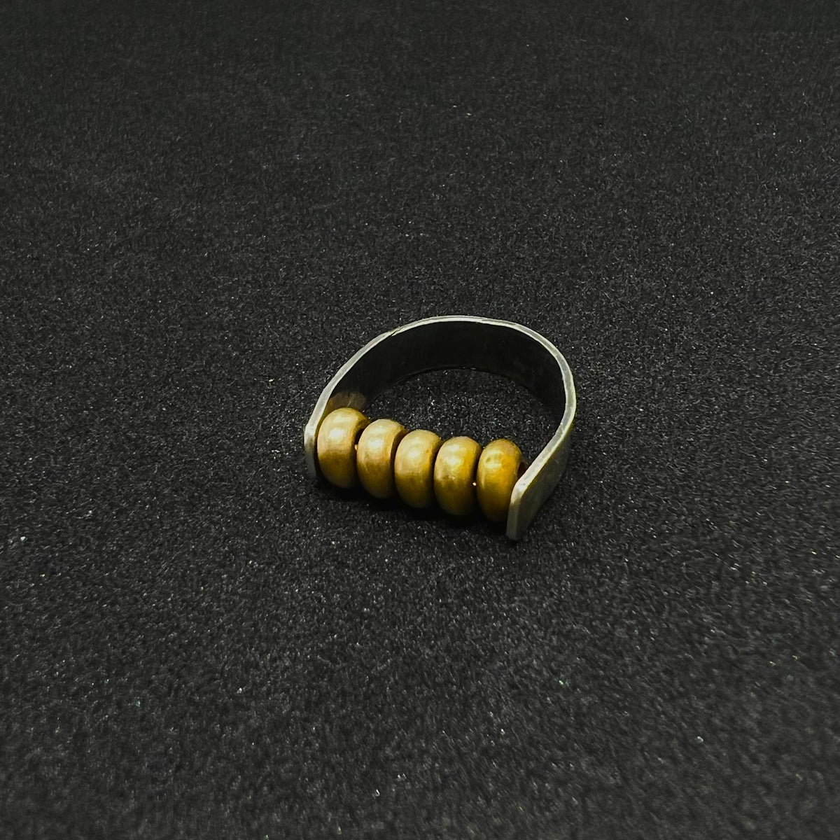 The Rolling Brass Bead Ring