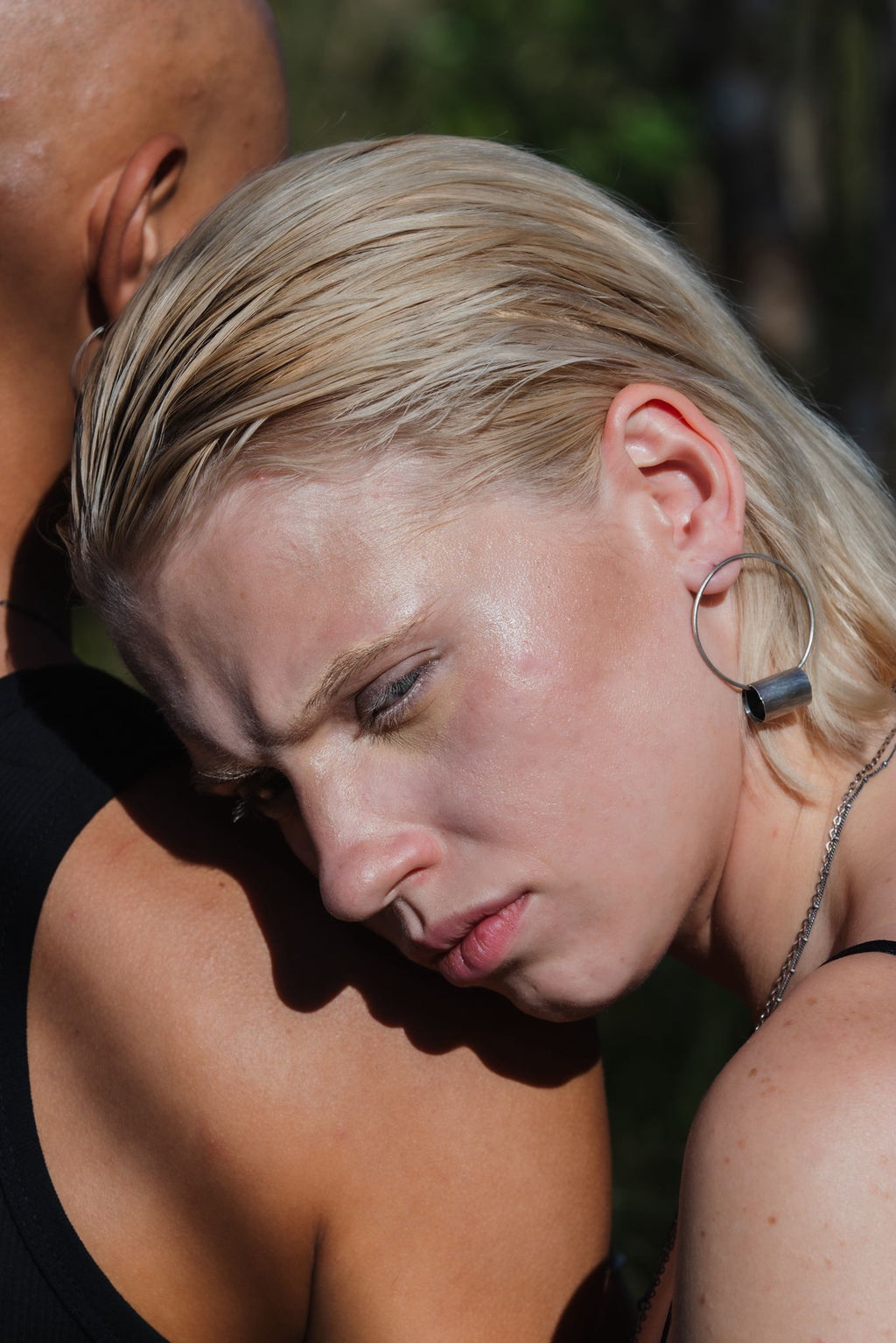 Model wearing the Log Hoop Earring in profile