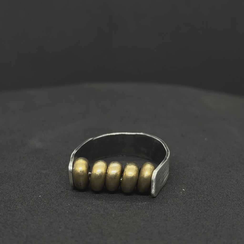 The Rolling Brass Bead Ring